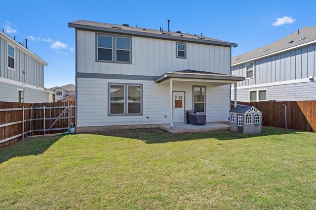 145 Fiery Skipper Ln, Georgetown, TX 78626 - back of house with a patio and board and batten siding