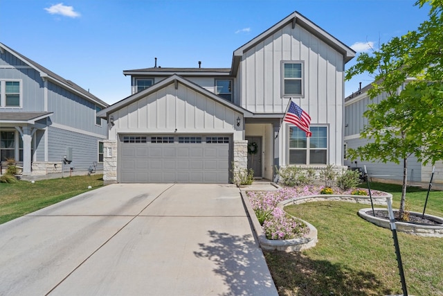 145 Fiery Skipper Ln, Georgetown, TX 78626 - view of front of house featuring board and batten siding, driveway, an attached garage, and a front lawn