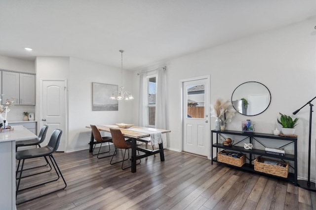 145 Fiery Skipper Ln, Georgetown, TX 78626 - dining room featuring dark wood-style flooring, a chandelier, baseboards, and recessed lighting