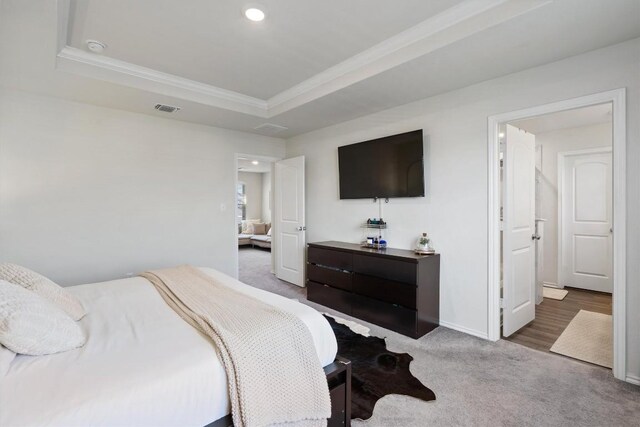 145 Fiery Skipper Ln, Georgetown, TX 78626 - carpeted bedroom with a raised ceiling, ornamental molding, baseboards, and recessed lighting