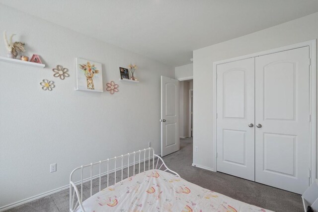 145 Fiery Skipper Ln, Georgetown, TX 78626 - carpeted bedroom with baseboards and a closet