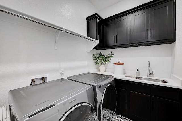422 Quiet Oak Rd, San Marcos, TX 78666 - laundry area with cabinet space, independent washer and dryer, and a sink
