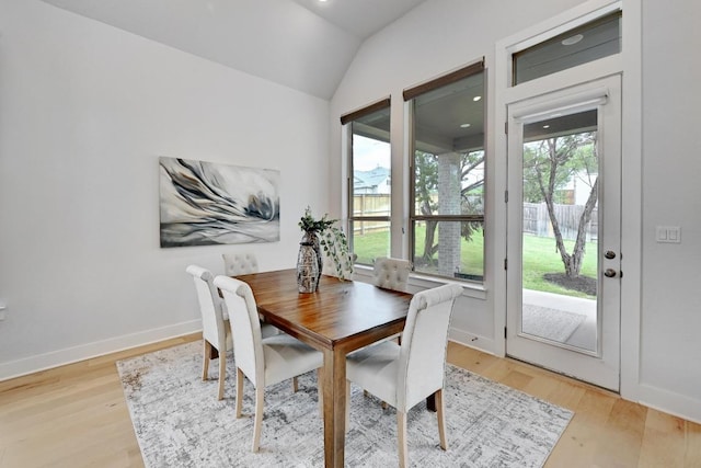422 Quiet Oak Rd, San Marcos, TX 78666 - dining room with light wood-style floors, vaulted ceiling, and baseboards