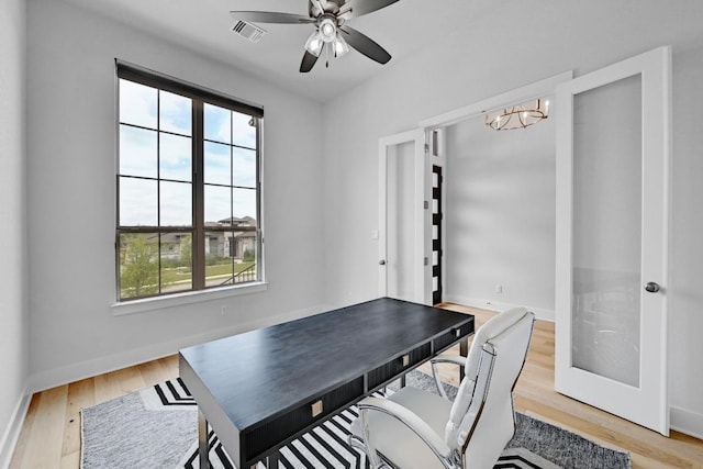 422 Quiet Oak Rd, San Marcos, TX 78666 - home office featuring baseboards, light wood-style floors, visible vents, and plenty of natural light