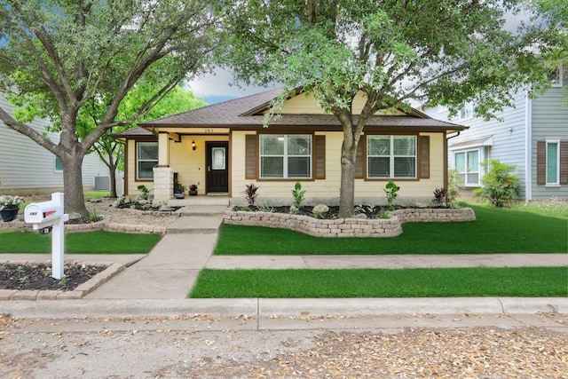 161 Caraway, Kyle, TX 78640 - view of front of home featuring a front yard and roof with shingles