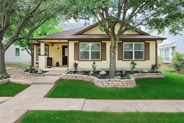 161 Caraway, Kyle, TX 78640 - view of front of house featuring a front yard, a shingled roof, and a porch