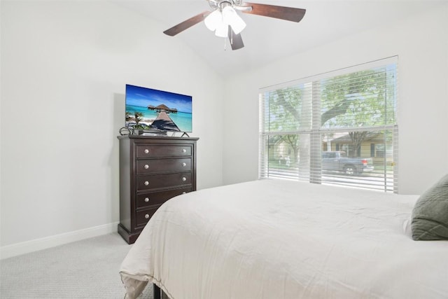 bedroom featuring vaulted ceiling, carpet flooring, baseboards, and ceiling fan