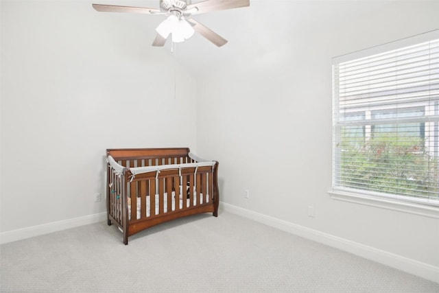 161 Caraway, Kyle, TX 78640 - bedroom featuring multiple windows, light colored carpet, and a nursery area