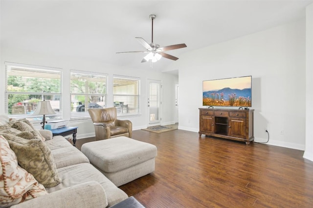 161 Caraway, Kyle, TX 78640 - living room featuring vaulted ceiling, ceiling fan, dark wood-style flooring, and baseboards