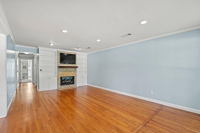 unfurnished living room featuring baseboards, crown molding, a multi sided fireplace, and light wood finished floors