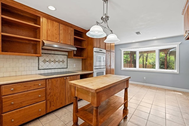 kitchen with light tile patterned flooring, white double oven, open shelves, light countertops, and under cabinet range hood