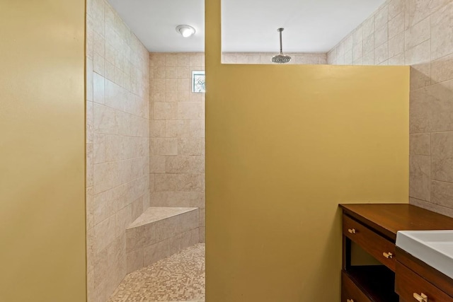 full bathroom with walk in shower and vanity
