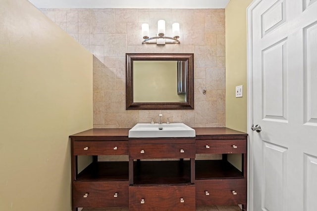 bathroom with tile walls and vanity