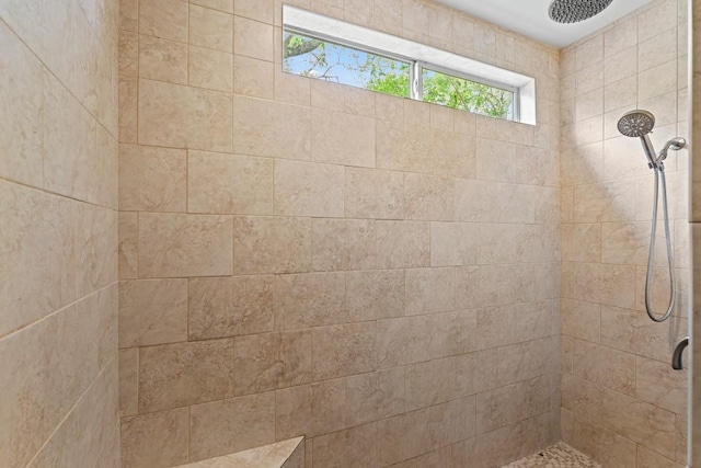 bathroom featuring a tile shower