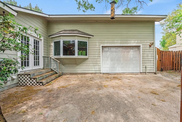 back of house with fence and french doors