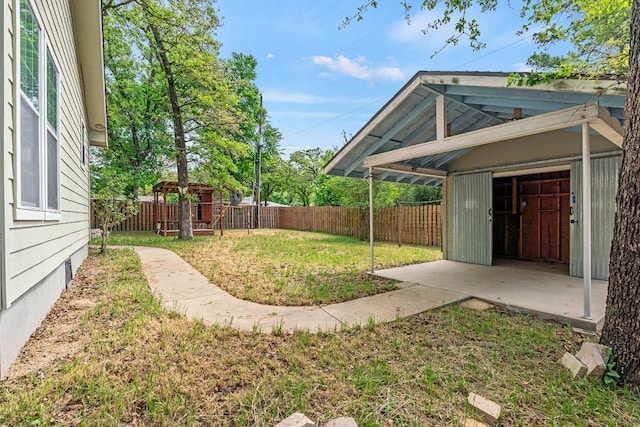 view of yard with a fenced backyard and a patio area