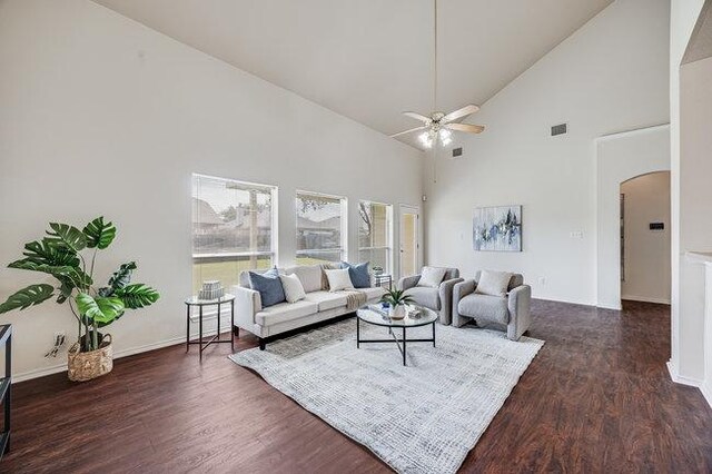 4001 Veiled Falls Dr, Pflugerville, TX 78660 - living area with arched walkways, a ceiling fan, high vaulted ceiling, wood finished floors, and baseboards
