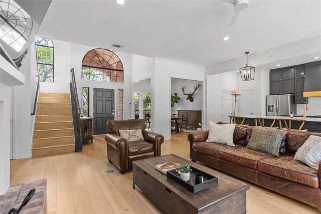 20 Hedgebrook Way, The Hills, TX 78738 - living area featuring light wood-style floors, stairway, plenty of natural light, and recessed lighting