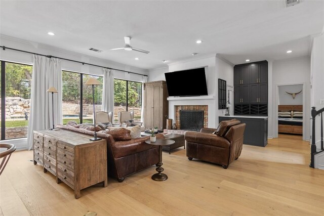 20 Hedgebrook Way, The Hills, TX 78738 - living room featuring ceiling fan, light wood finished floors, healthy amount of natural light, a fireplace, and recessed lighting