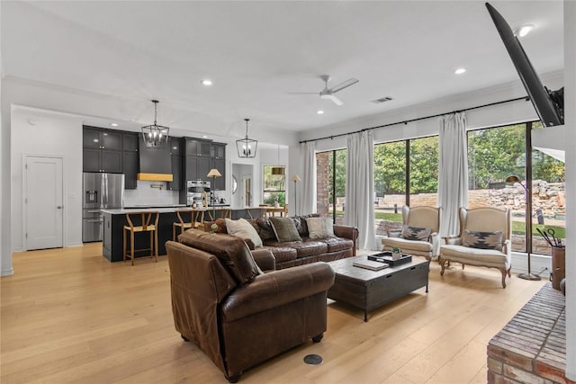 20 Hedgebrook Way, The Hills, TX 78738 - living room with light wood-type flooring, ceiling fan, plenty of natural light, and recessed lighting