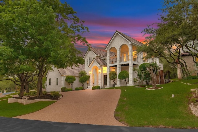 20 Hedgebrook Way, The Hills, TX 78738 - french country inspired facade featuring a balcony and a lawn