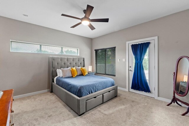 503 Swanee Dr Unit 11, Austin, TX 78752 - bedroom featuring access to outside, carpet floors, and a ceiling fan