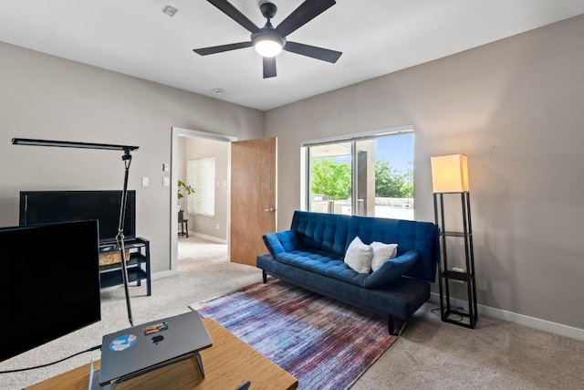 503 Swanee Dr Unit 11, Austin, TX 78752 - living room featuring healthy amount of natural light, ceiling fan, and carpet flooring