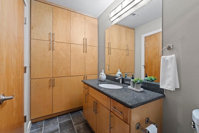 503 Swanee Dr Unit 11, Austin, TX 78752 - bathroom with vanity and toilet