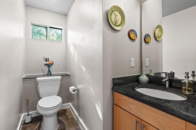 503 Swanee Dr Unit 11, Austin, TX 78752 - bathroom featuring vanity and toilet