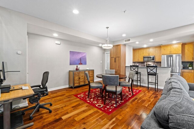 503 Swanee Dr Unit 11, Austin, TX 78752 - dining room featuring recessed lighting, wood finished floors, and an office area