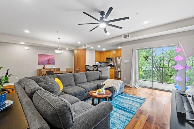 503 Swanee Dr Unit 11, Austin, TX 78752 - living room with recessed lighting, light wood finished floors, and a ceiling fan