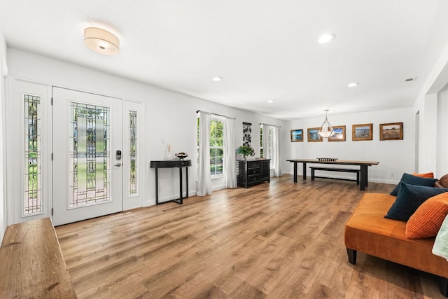 interior space featuring recessed lighting, light wood-style floors, visible vents, and a chandelier
