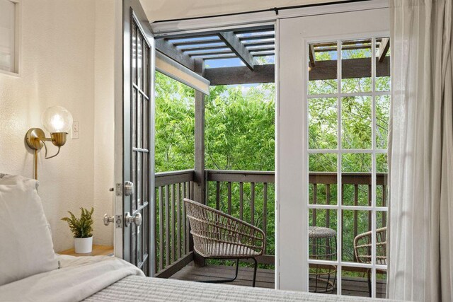 doorway to outside featuring a textured wall