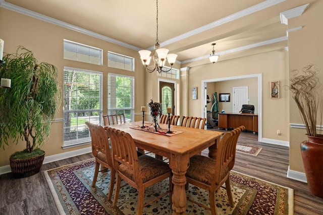 135 N Tumbleweed Trl, Austin, TX 78733 - dining area featuring wood finished floors, crown molding, and a chandelier