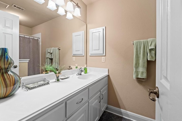 135 N Tumbleweed Trl, Austin, TX 78733 - bathroom featuring vanity and baseboards
