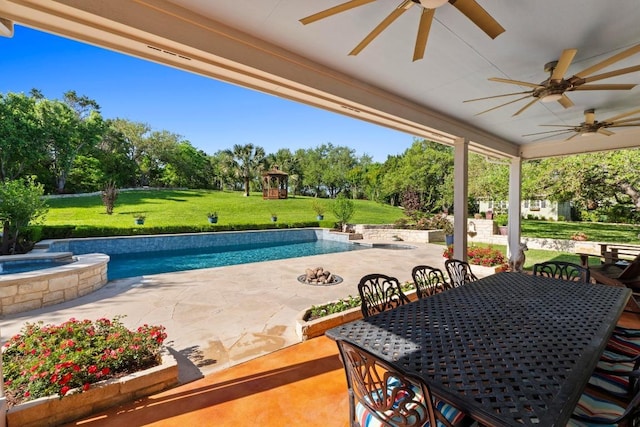 135 N Tumbleweed Trl, Austin, TX 78733 - view of swimming pool with ceiling fan, a lawn, outdoor dining area, and a patio area