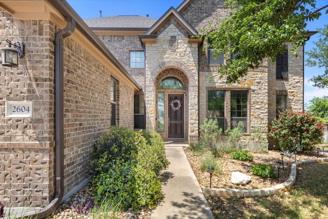 2604 Outlook Ridge Loop, Leander, TX 78641 - view of exterior entry with brick siding and stone siding