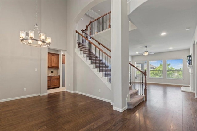 2604 Outlook Ridge Loop, Leander, TX 78641 - stairway with ceiling fan, baseboards, hardwood / wood-style floors, arched walkways, and recessed lighting