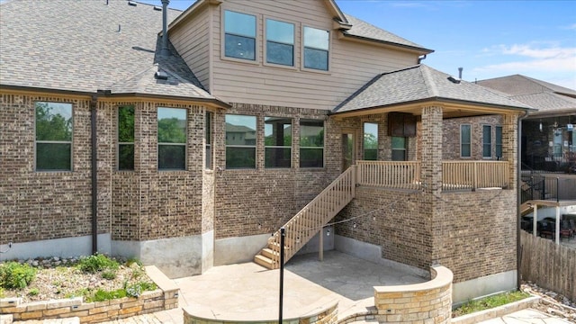 2604 Outlook Ridge Loop, Leander, TX 78641 - back of house featuring brick siding, a patio, and fence