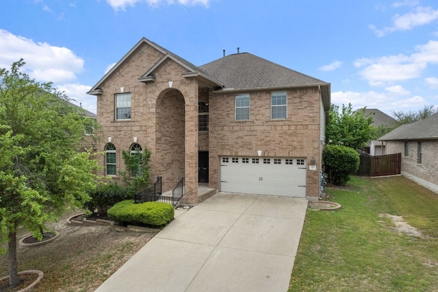 188 Rock Vista Run, Austin, TX 78737 - traditional-style house featuring brick siding, a garage, driveway, and roof with shingles