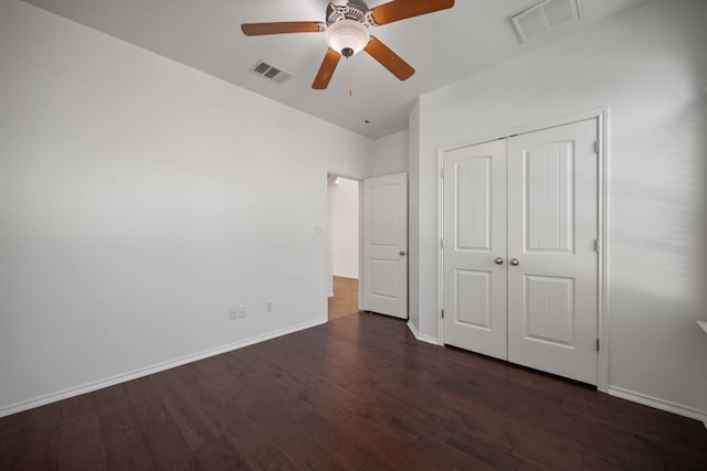188 Rock Vista Run, Austin, TX 78737 - unfurnished bedroom with dark wood-style floors, baseboards, a closet, and ceiling fan