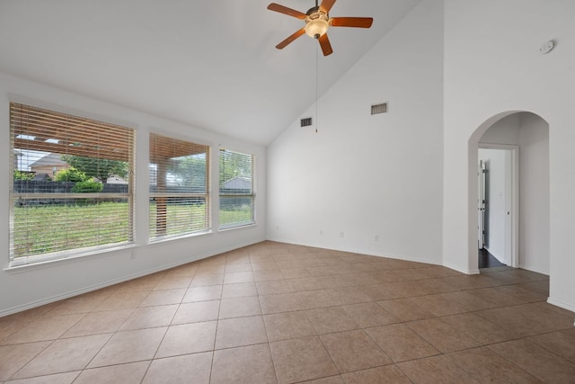 188 Rock Vista Run, Austin, TX 78737 - unfurnished room featuring high vaulted ceiling, healthy amount of natural light, ceiling fan, light tile patterned floors, and arched walkways