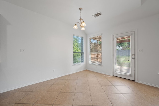188 Rock Vista Run, Austin, TX 78737 - unfurnished dining area featuring a chandelier, vaulted ceiling, light tile patterned floors, and baseboards