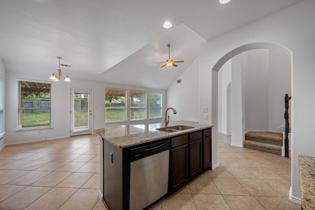 188 Rock Vista Run, Austin, TX 78737 - kitchen featuring dishwasher, a sink, light tile patterned flooring, vaulted ceiling, and open floor plan