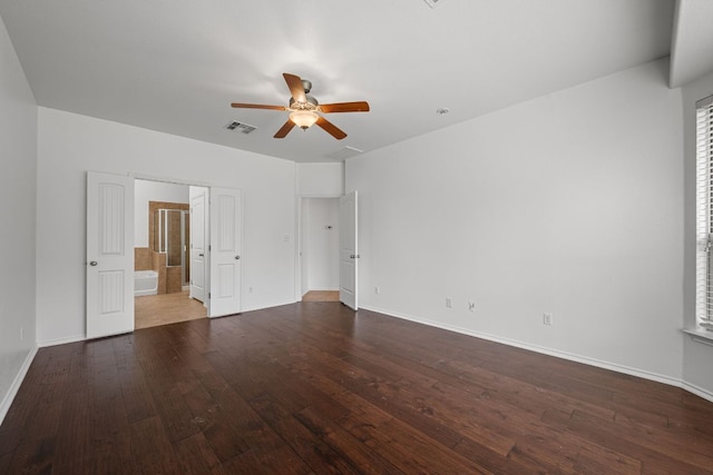 188 Rock Vista Run, Austin, TX 78737 - unfurnished bedroom with wood-type flooring, baseboards, ensuite bath, and ceiling fan