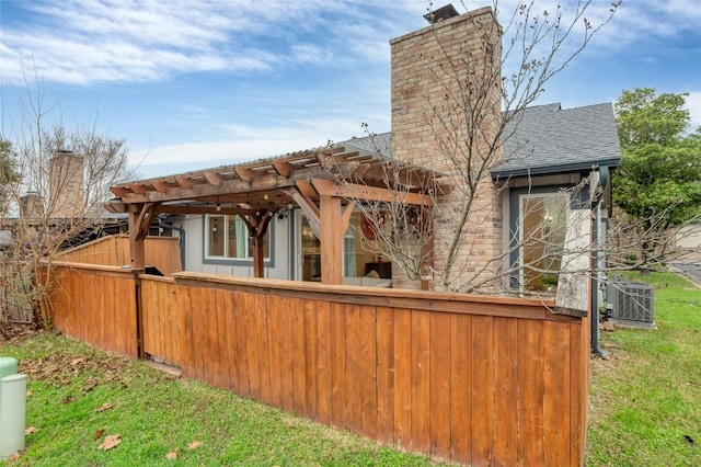 9458 Singing Quail Dr, Austin, TX 78758 - view of home's exterior featuring a chimney, a pergola, and a shingled roof