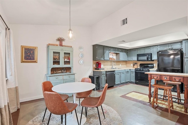 9458 Singing Quail Dr, Austin, TX 78758 - dining room with finished concrete floors and baseboards