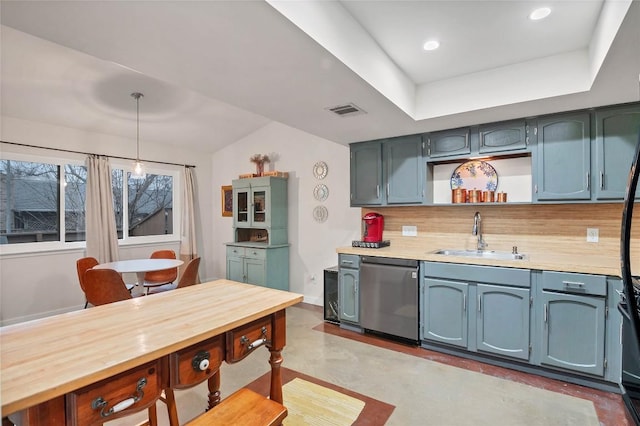 9458 Singing Quail Dr, Austin, TX 78758 - kitchen with dishwasher, light countertops, decorative light fixtures, open shelves, and tasteful backsplash