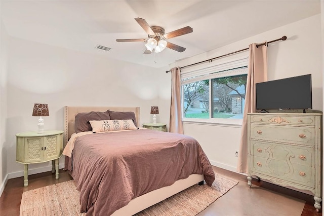 9458 Singing Quail Dr, Austin, TX 78758 - bedroom with finished concrete flooring and ceiling fan