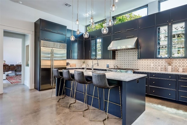 kitchen with visible vents, under cabinet range hood, finished concrete flooring, and appliances with stainless steel finishes